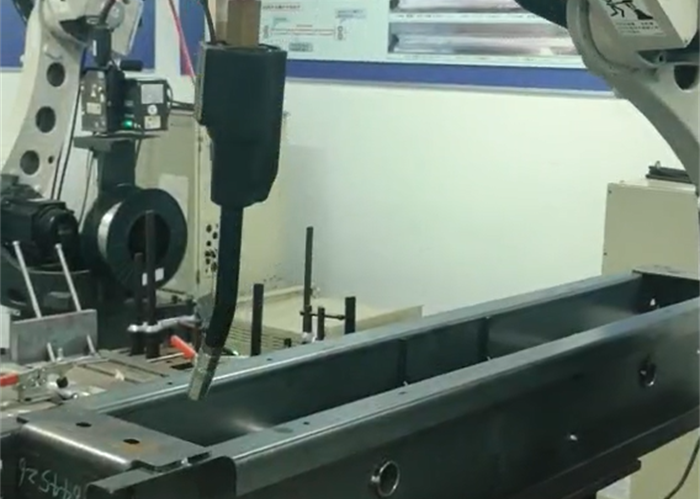 Elevator beam raising robot workstation